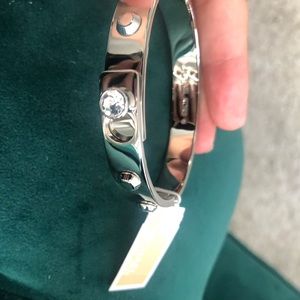 Silver Michael Kors grommet bracelet bangle